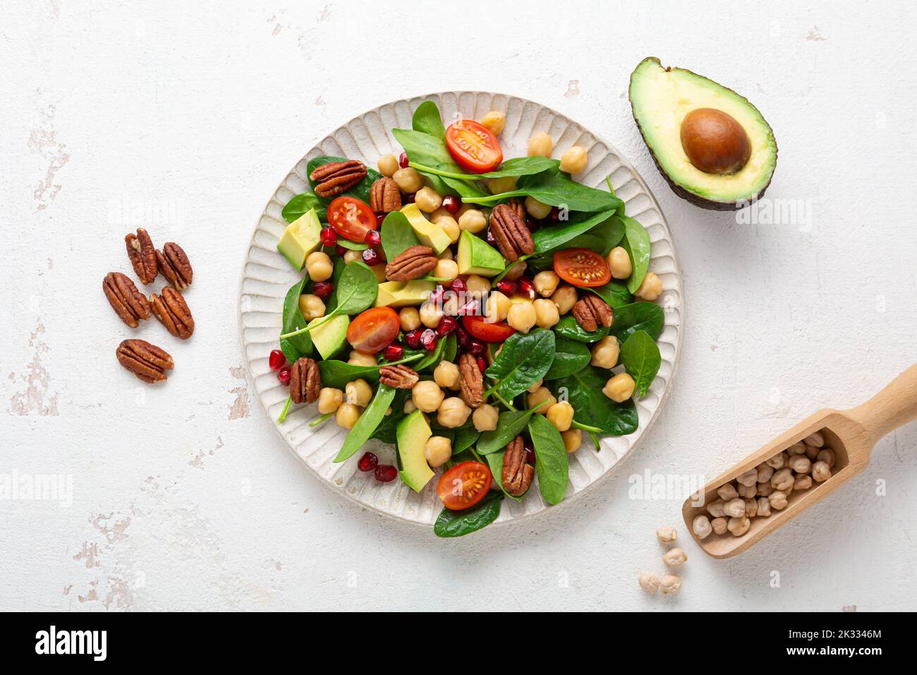 Vegan salad with chick-pea avocado spinach top view healthy food Stock Photo