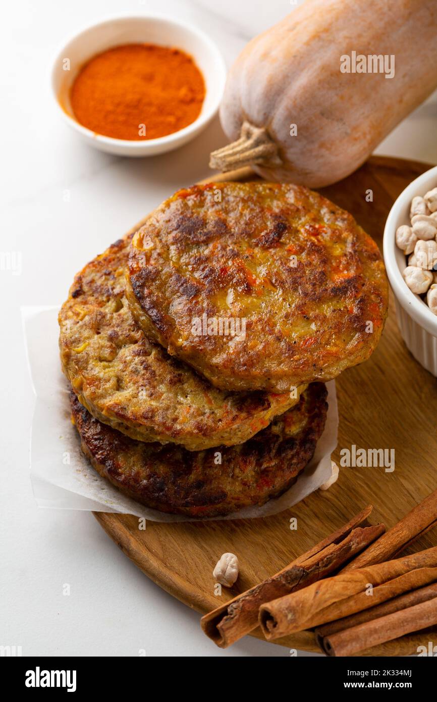 Pumpkin vegan fritters and raw ingredients food Stock Photo