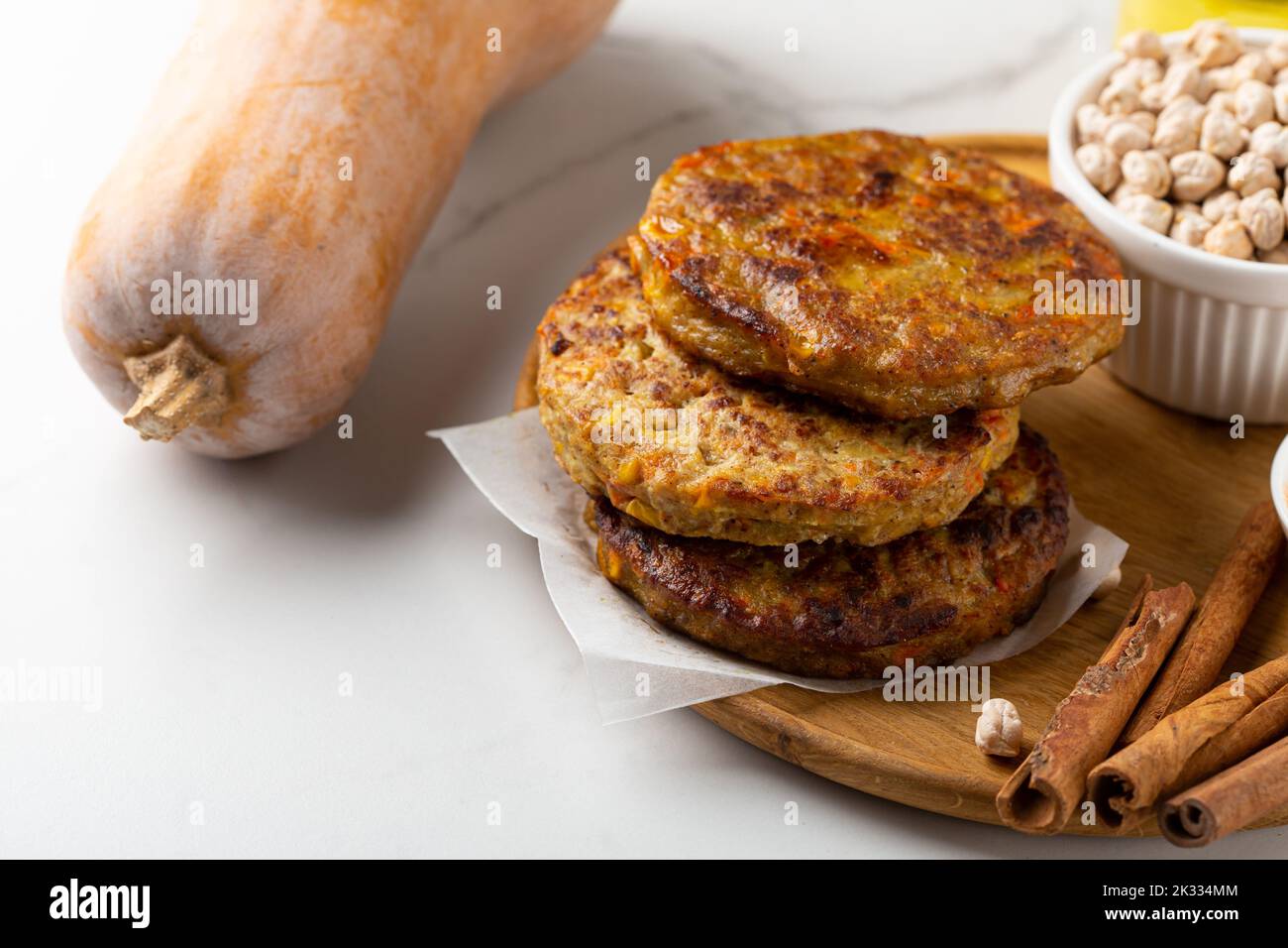 Pumpkin vegan fritters and raw ingredients food copy space Stock Photo