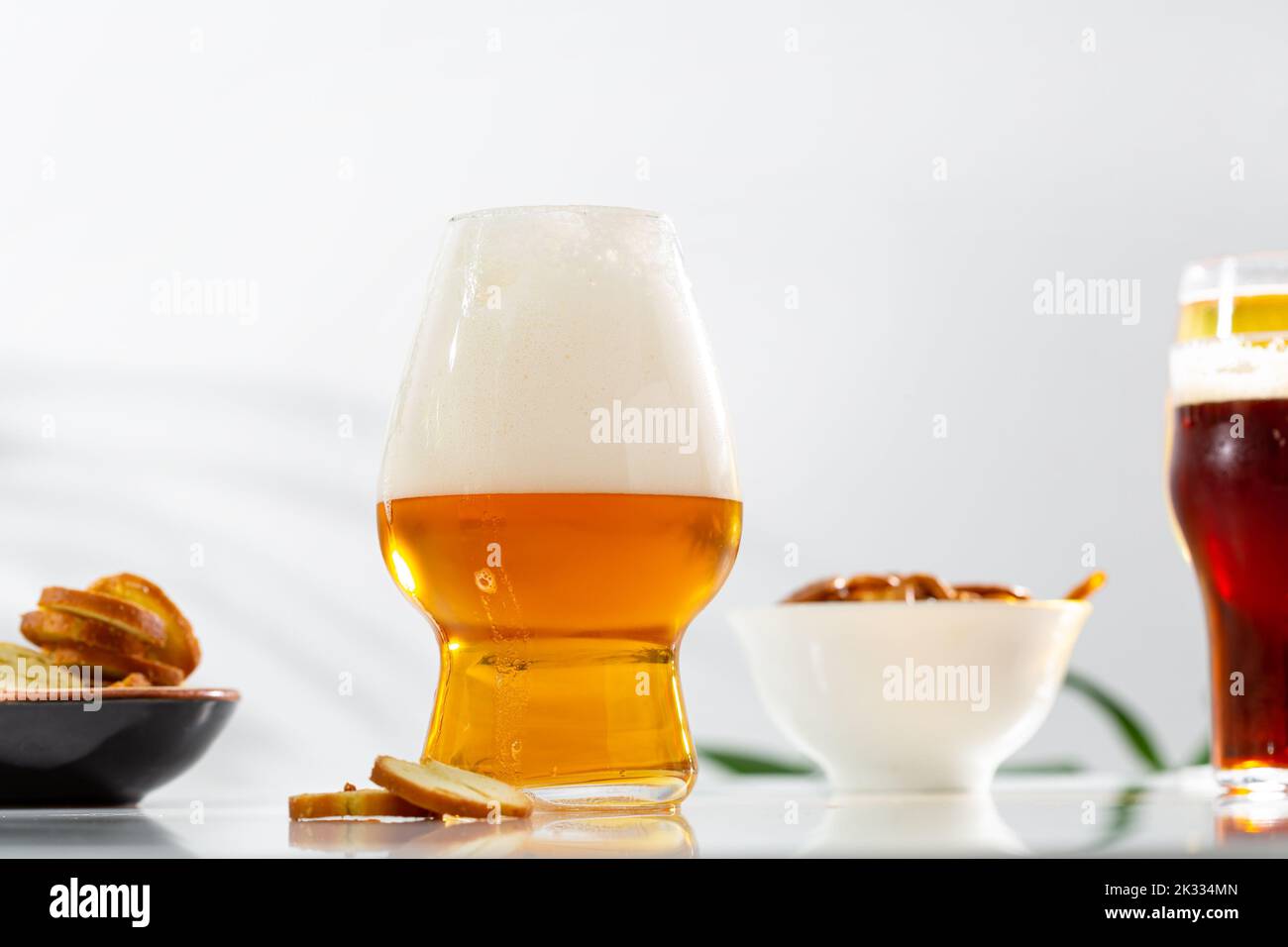 Beer in glass with foam snack light surface Stock Photo
