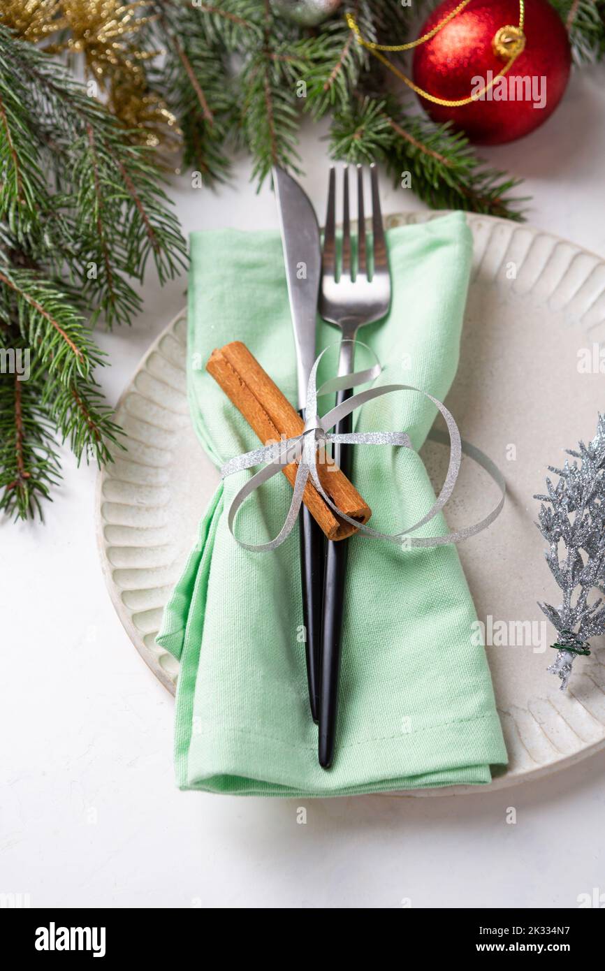 White plate and christmas decorations table setting close up Stock Photo
