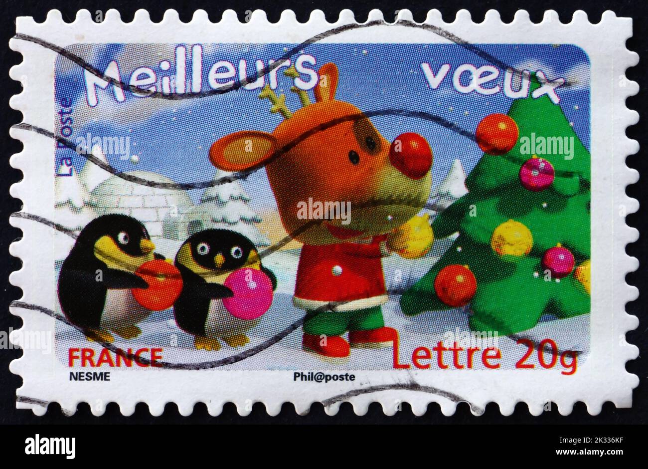 FRANCE - CIRCA 2006: a stamp printed in France shows Reindeer, Christmas Tree and Two Penguins, Holiday Greeting, circa 2006 Stock Photo