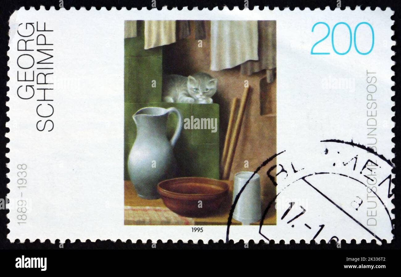 GERMANY - CIRCA 1995: a stamp printed in Germany shows Still life with a cat, painting by Georg Schrimpf, German painter, circa 1995 Stock Photo