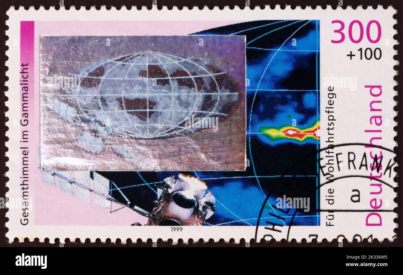 GERMANY - CIRCA 1999: a stamp printed in Germany shows gamma ray image of entire sky, satellite, circa 1999 Stock Photo