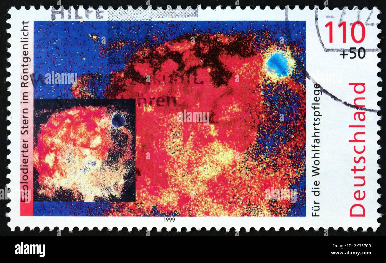 GERMANY - CIRCA 1999: a stamp printed in Germany shows X-ray image of exploding star, the Cosmos, circa 1999 Stock Photo
