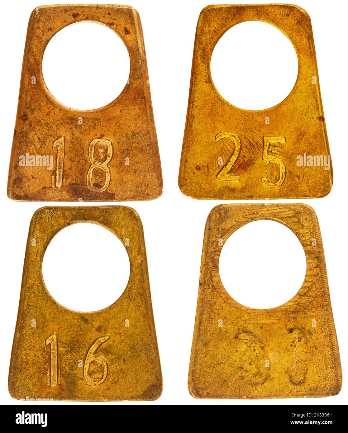 Collection of ancient brass cloakroom labels isolated on white