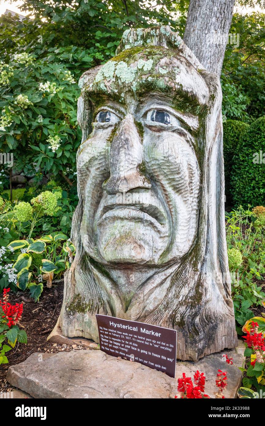 Humorous wooden carved statue to chief Big Nose, a native American Indian living near to Lake Geneva, Wisconsin county, America, USA Stock Photo