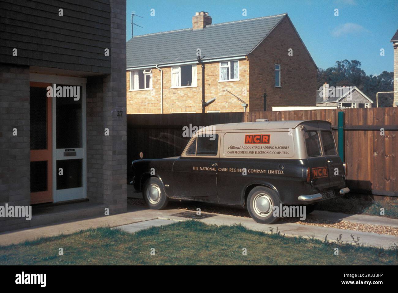 An old NCR Ford Anglia van parked on a house driveway in the 1960s Stock Photo