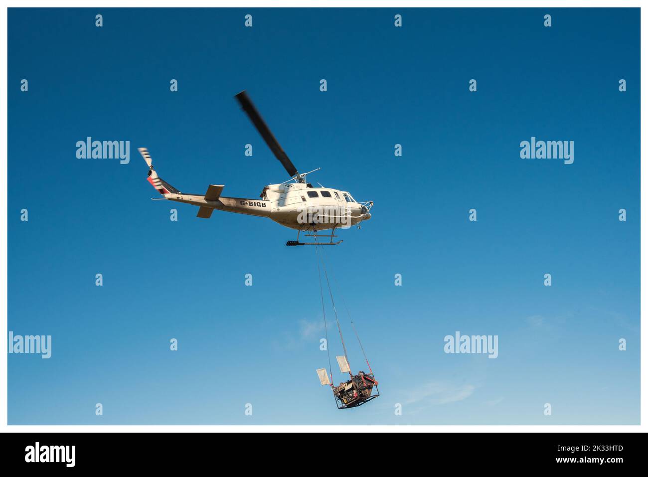 Heli-lift Services helicopter G-BIGB involved in peatland restoration work  at Fountains Fell in the Yorkshire Dales National Park 23rd September 2022 Stock Photo