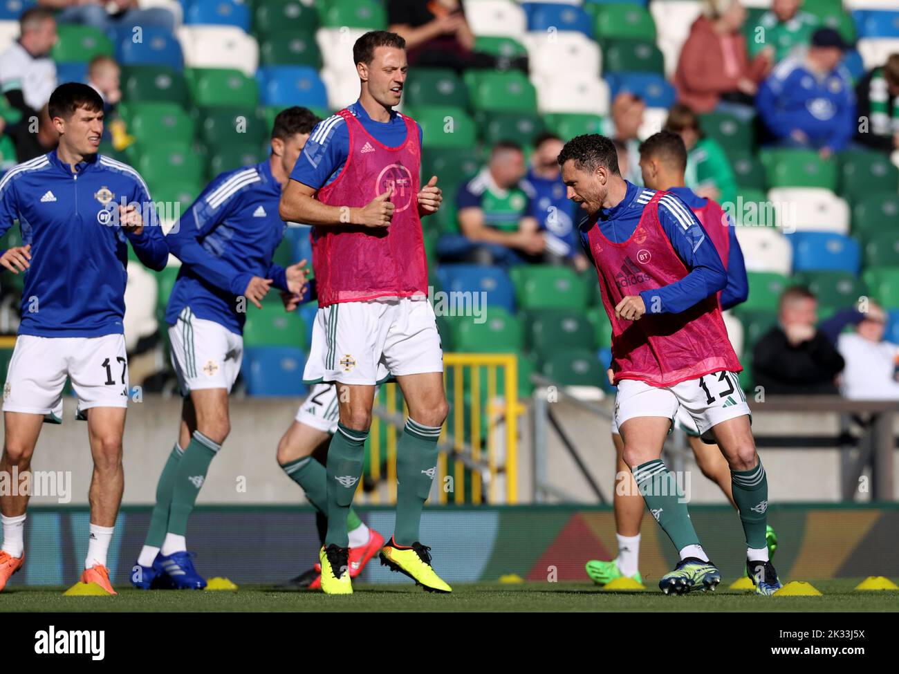 Northern Ireland's Jonny Evans (centre) and Corry Evans (right) during the warm up before the UEFA Nations League Group J Match at Windsor Park, Belfast. Picture date: Saturday September 24, 2022. Stock Photo