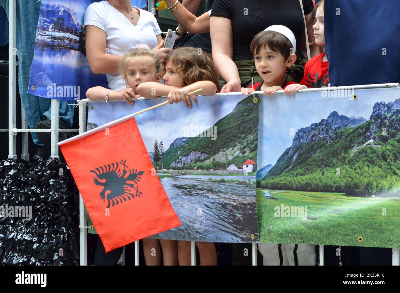 The kids during the 37th Annual NYC Immigrants Parade holding landscape pictures and the Albanian flag Stock Photo