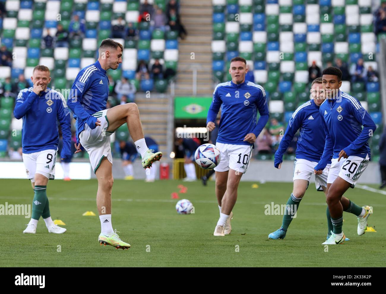 Northern Ireland's Gavin Whyte (second left) during the warm up before the UEFA Nations League Group J Match at Windsor Park, Belfast. Picture date: Saturday September 24, 2022. Stock Photo