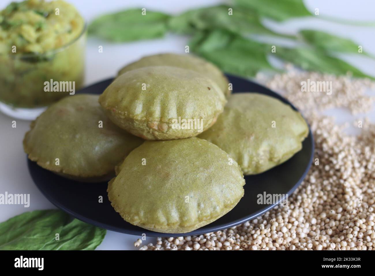 Jowar palak puri or spinach fried flat bread. Fried bread made