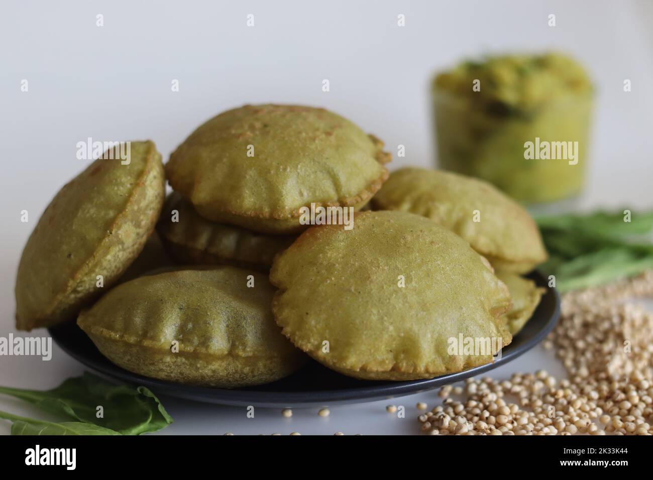 Jowar palak puri or spinach fried flat bread. Fried bread made of millet flour