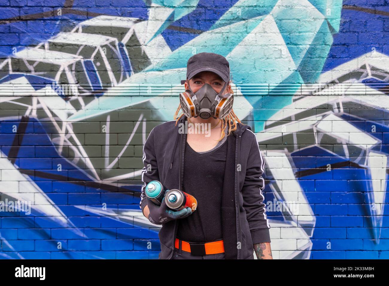 Birmingham, UK. 24th Sep, 2022. 'Annatomix', one of about a dozen women street graffiti artists working on walls in Digbeth as part of the High Vis Street Art Festival at the Tea Works. Street art of this kind is often seen as a male dominated culture, but this is changing. Credit: Peter Lopeman/Alamy Live News Stock Photo