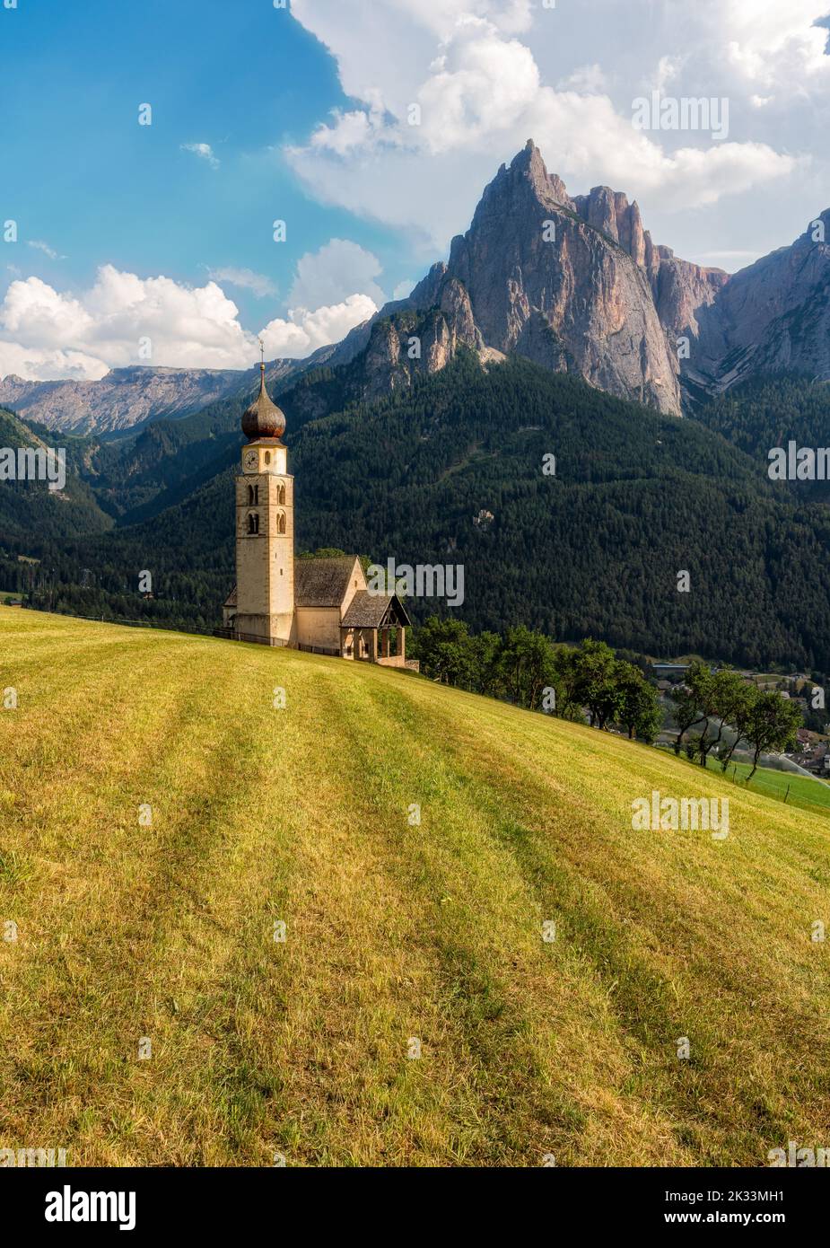 Beautiful view with the Church of San Valentino and the Sciliar Massif. Castelrotto, Bolzano, Trentino Alto Adige, Italy. Stock Photo