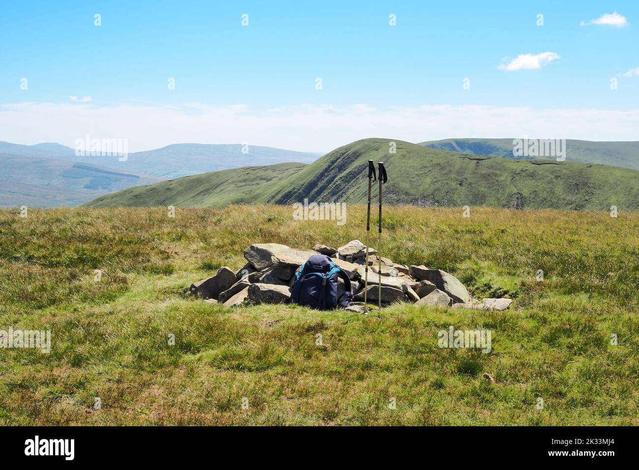 Rucksack and walking poles at summit of Randygill Top, Howgill Fells, Cumbria Stock Photo