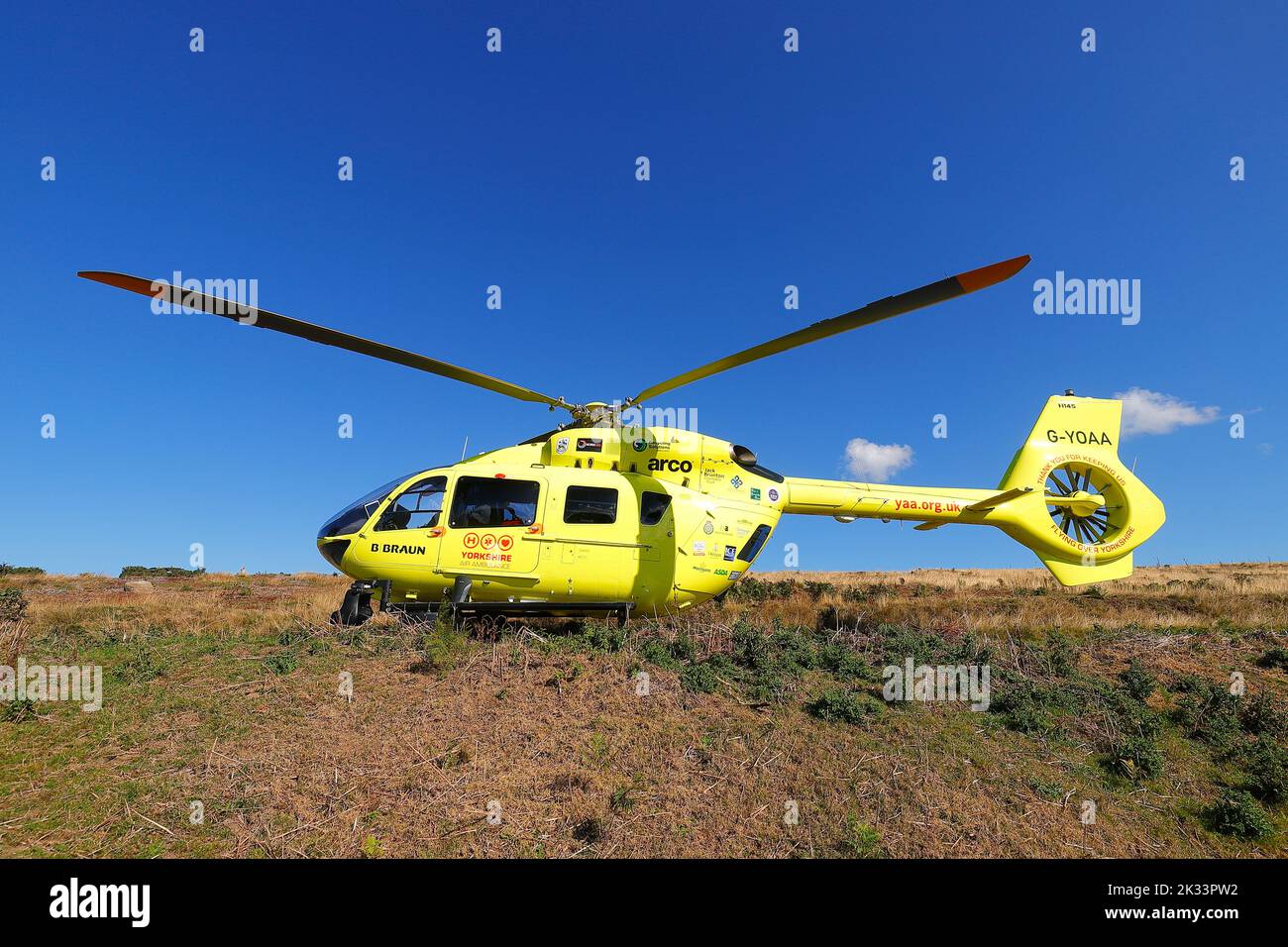 The Yorkshire Air Ambulance makes a landing on the North Yorkshire Moors, after a man fell from the station platform at Goathland Station Stock Photo