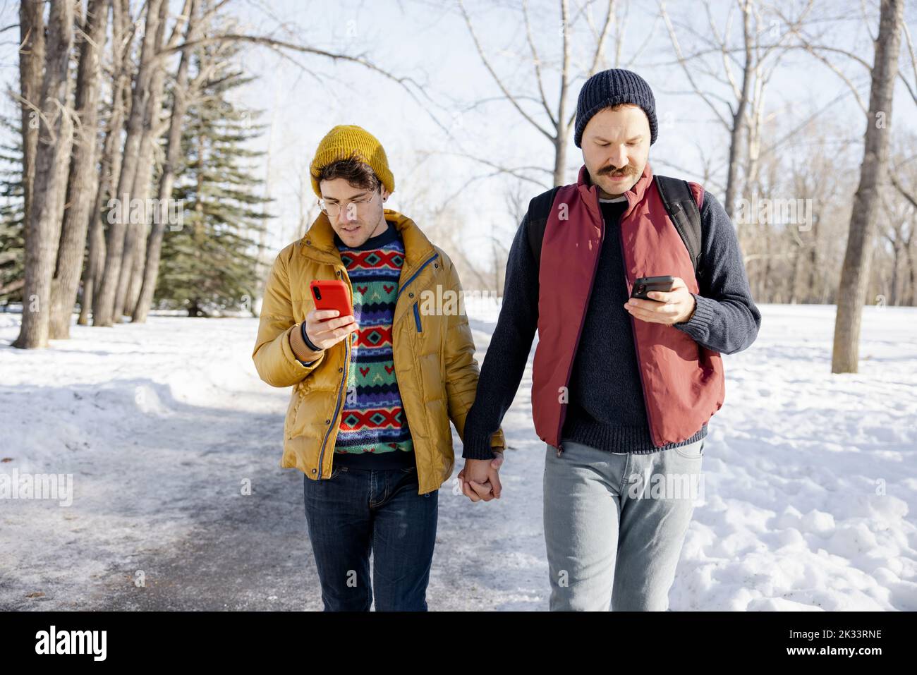 Smart couple holding hands hi-res stock photography and images - Alamy