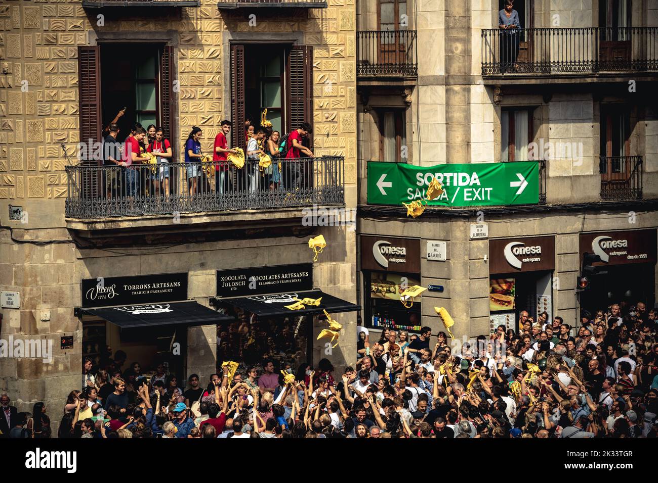 Barcelona, Spain. 24th Sep, 2022. Catalan pro-independence activists throw bags reading 'proud to be a Barcelonian' to the crowd during the 'Diada Castellera' at Barcelona's city festival 'La Merce' Credit: Matthias Oesterle/Alamy Live News Stock Photo