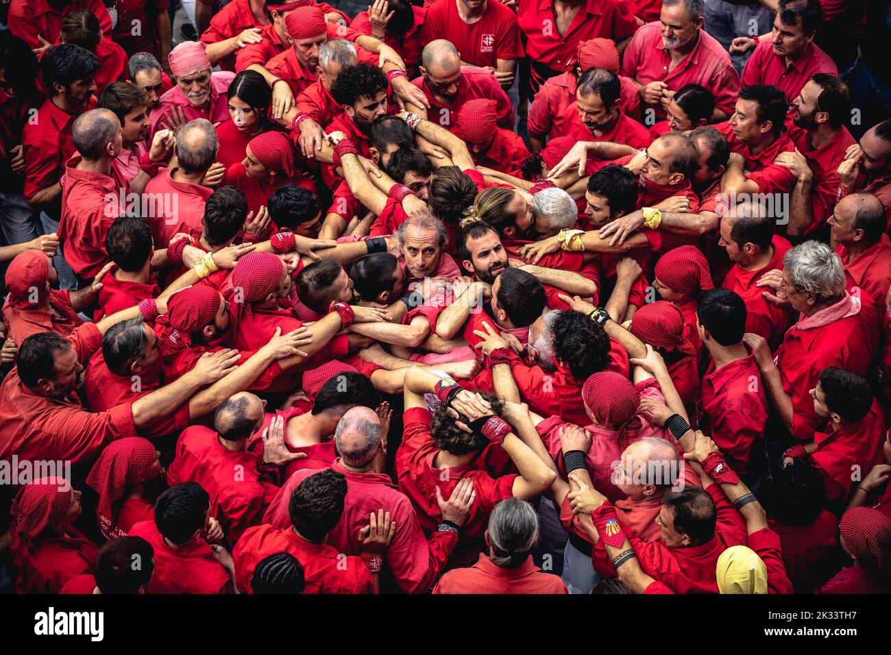Barcelona, Spain. 24th Sep, 2022. The 'Castellers de Barcelona' gather to form the base of a human tower during the 'Diada Castellera' at Barcelona's city festival 'La Merce' Credit: Matthias Oesterle/Alamy Live News Stock Photo