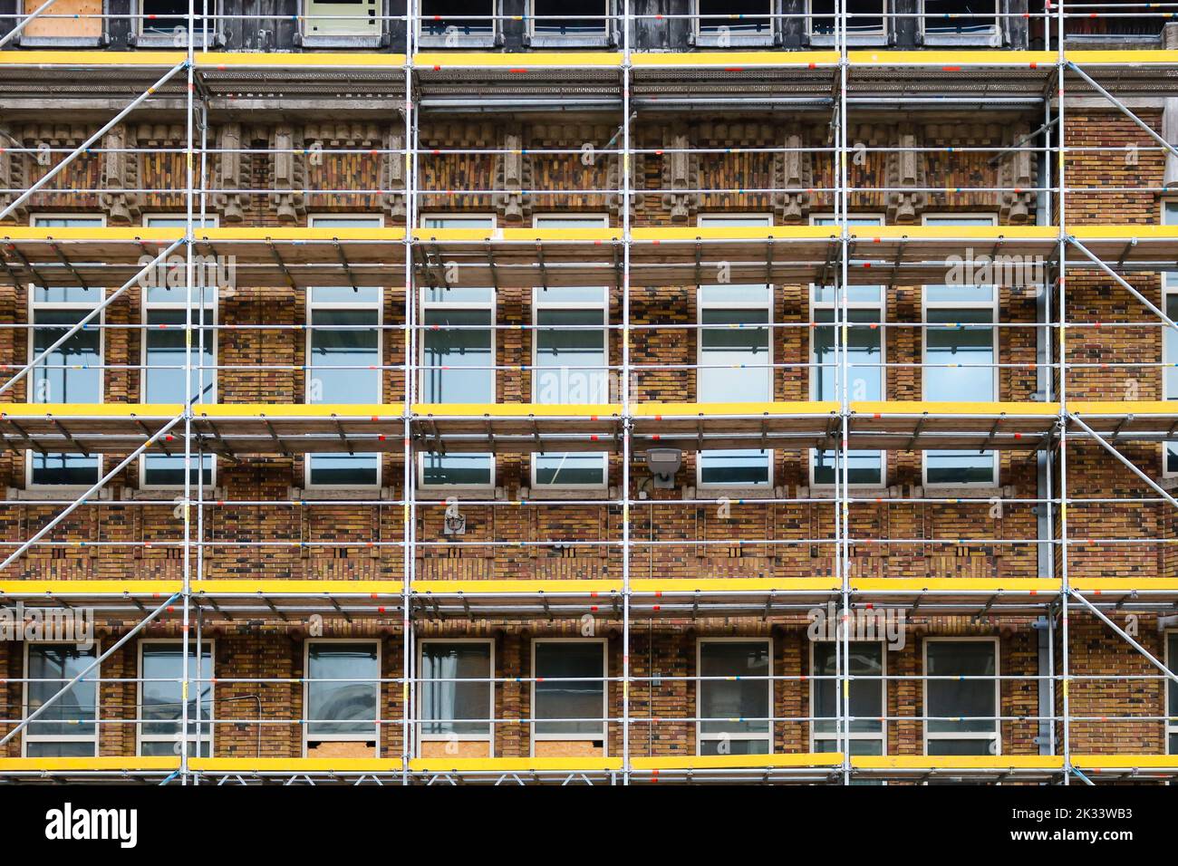 Scaffolding for renovation works on brick building Stock Photo