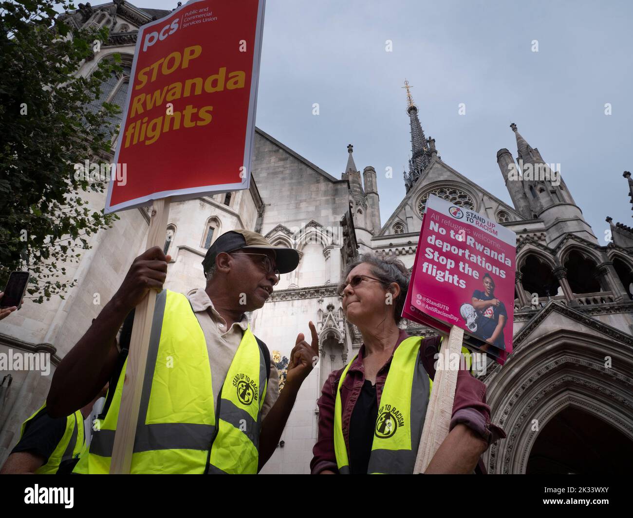 Protestors and demonstrators outside the Royal Court of  justice, during legal challenge to Government Rwanda deportation policy, brought by Care4Calais, Detention Action, Public and Commercial Services Union and asylum seekers facing deportation Stock Photo