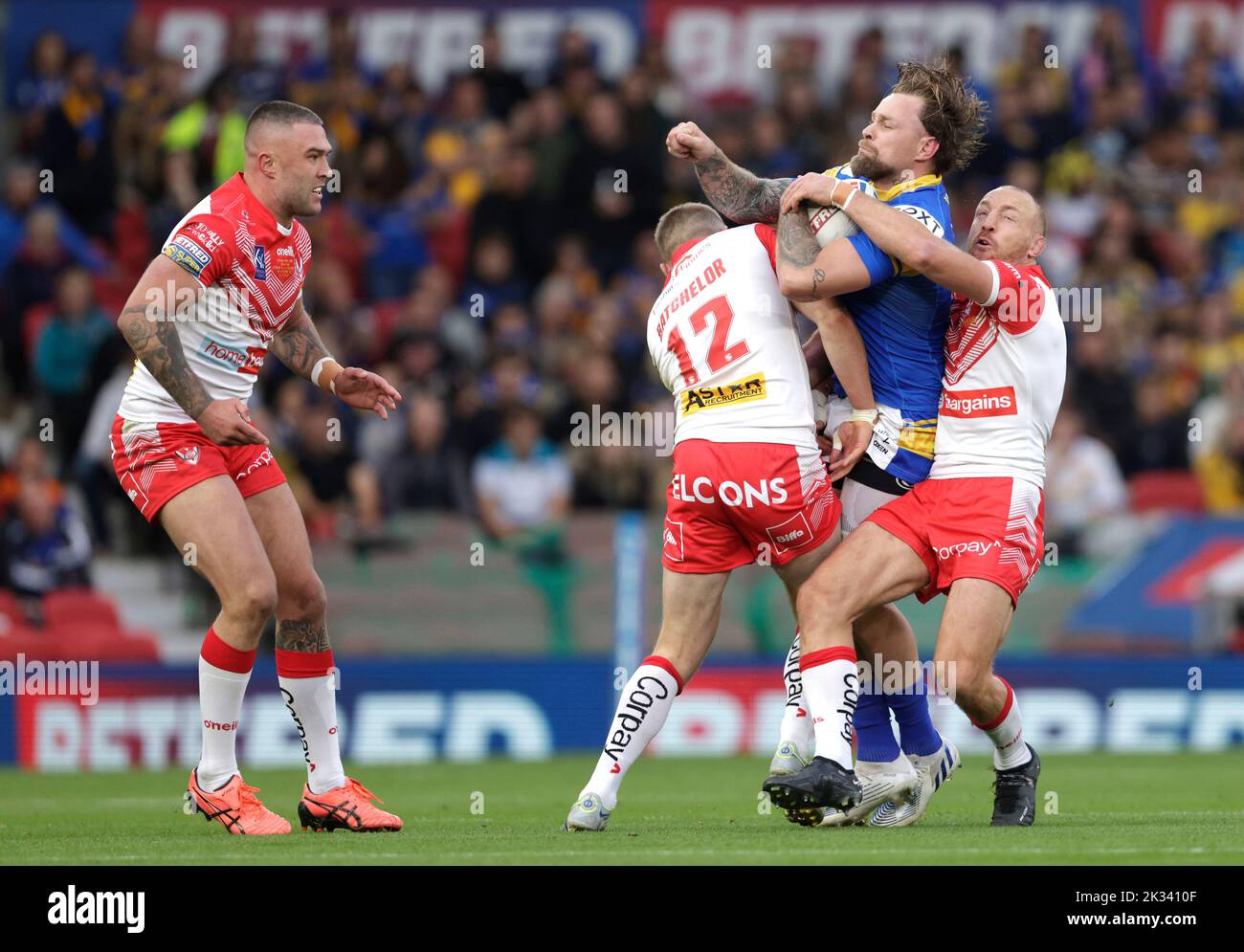 Leeds Rhinos' Blake Austin is tackled by St Helens' Joe Batchelor during the Betfred Super League Grand Final at Old Trafford, Manchester. Picture date: Saturday September 24, 2022. Stock Photo