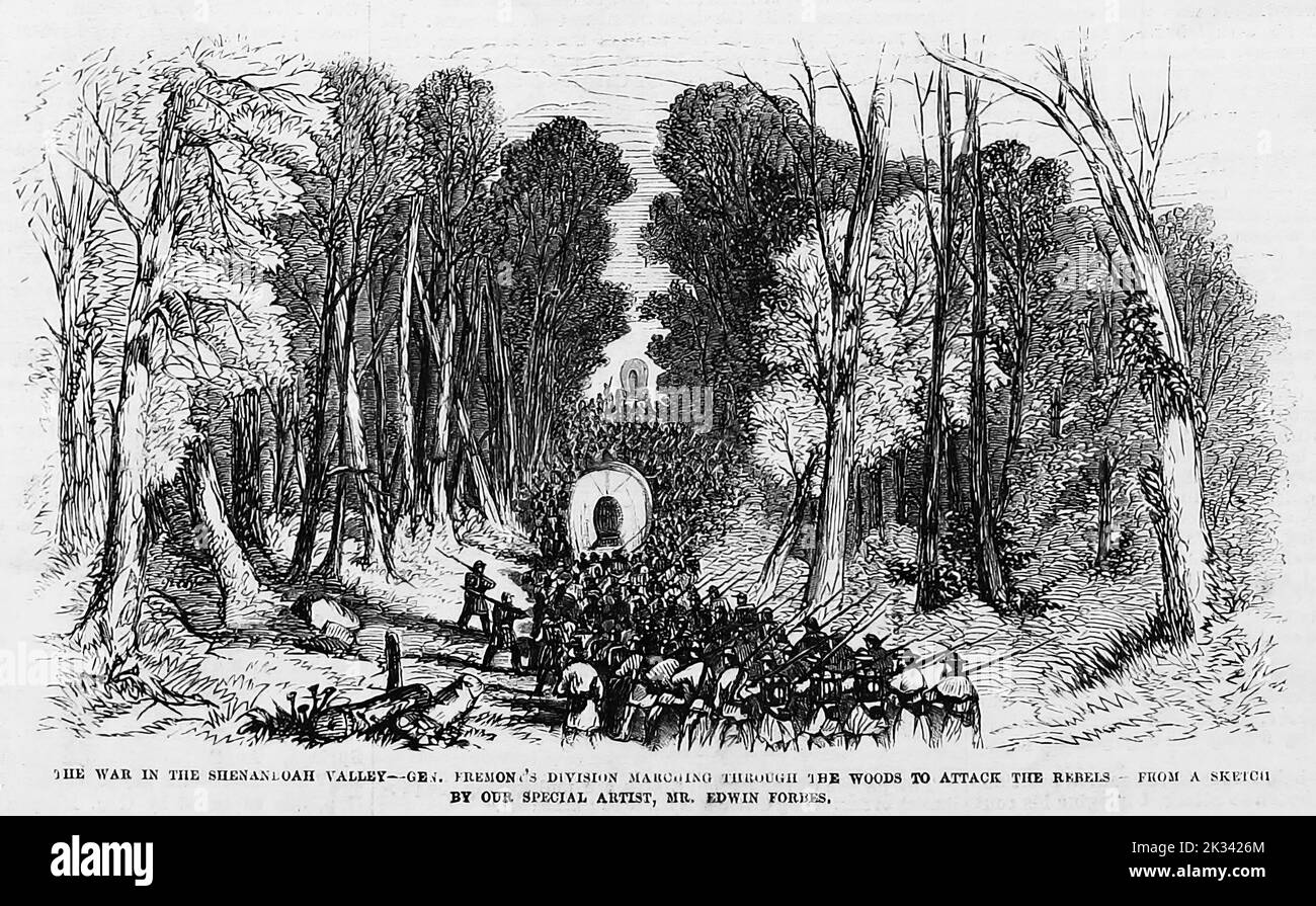 The War in the Shenandoah Valley - General John Charles Frémont's division marching through the woods to attack the Rebels. June 1862. 19th century American Civil War illustration from Frank Leslie's Illustrated Newspaper Stock Photo