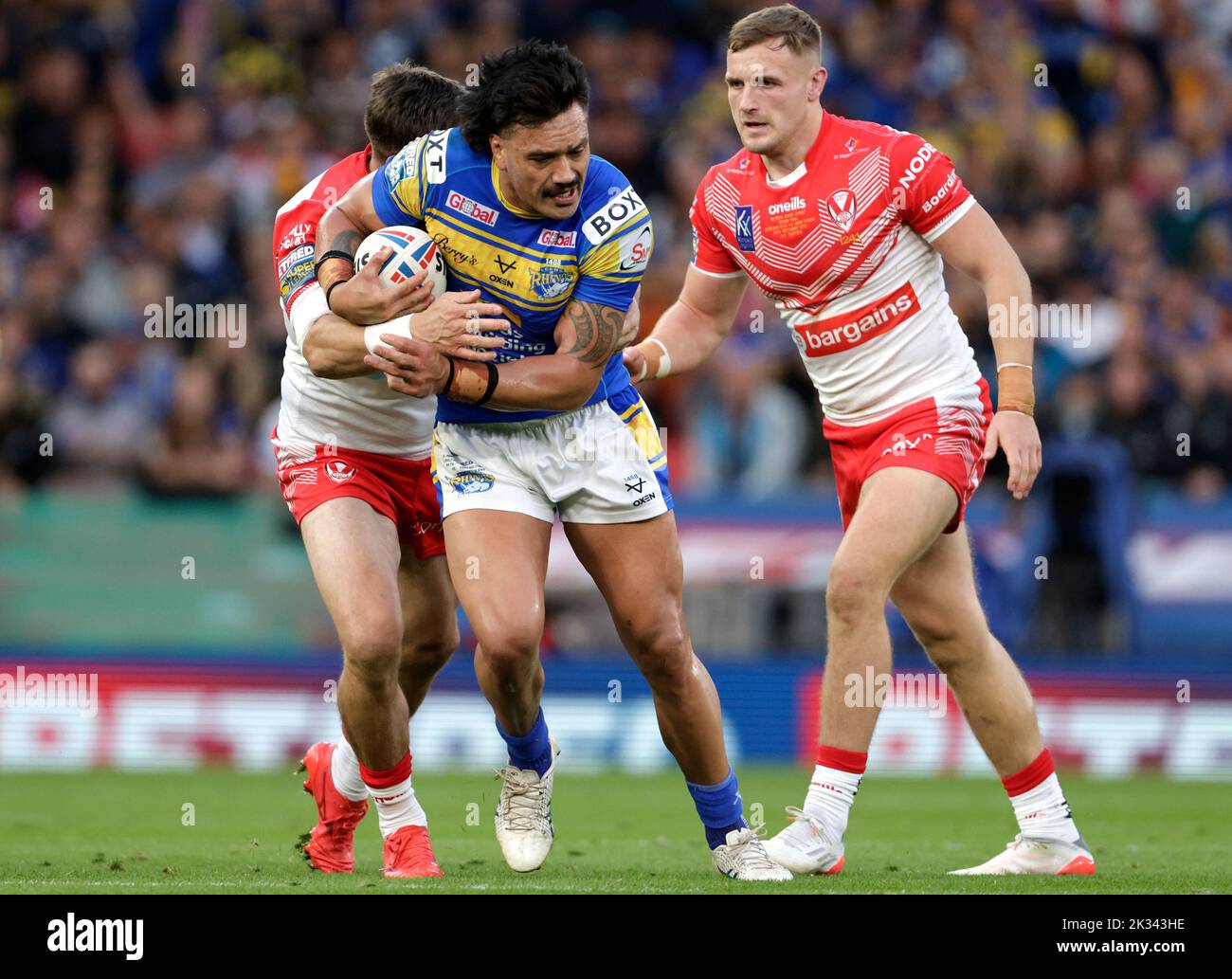 Leeds Rhinos' Zane Tetevano (centre) is tackled during the Betfred Super League Grand Final at Old Trafford, Manchester. Picture date: Saturday September 24, 2022. Stock Photo