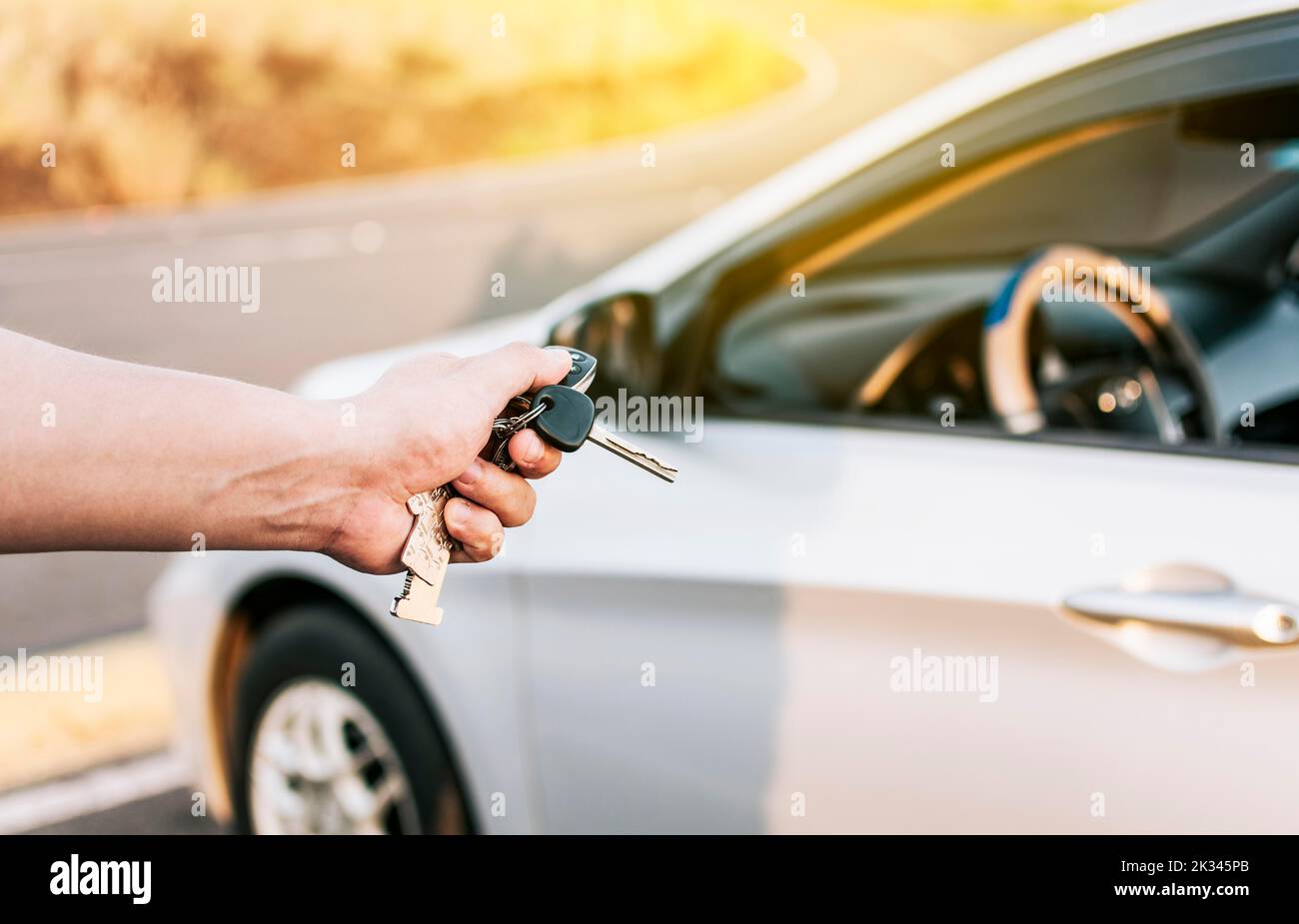 Driver hands showing the keys outside the vehicle, Vehicle rental
