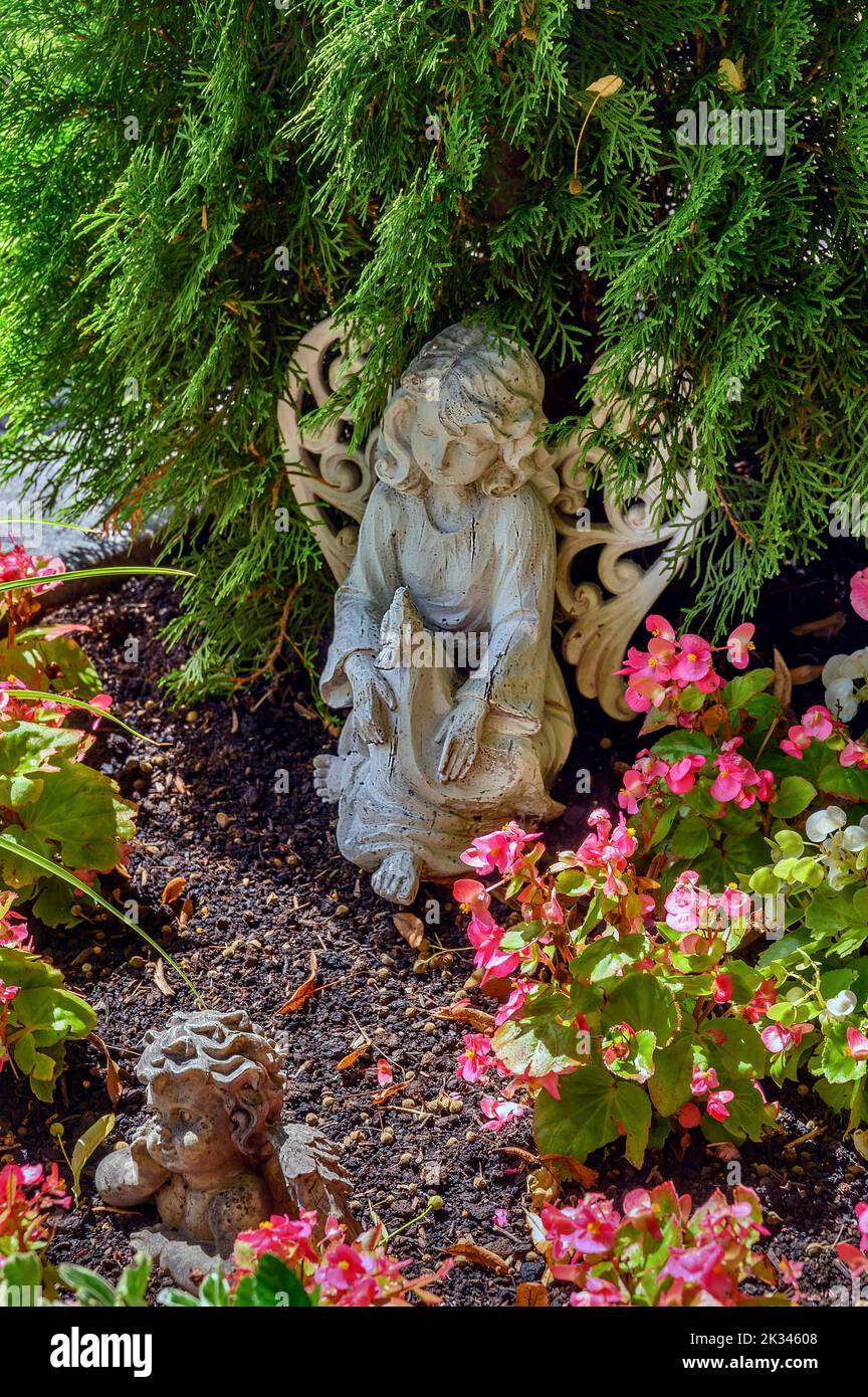 Grave with putto and angel in Betzigau, Allgaeu, Bavaria, Germany Stock Photo