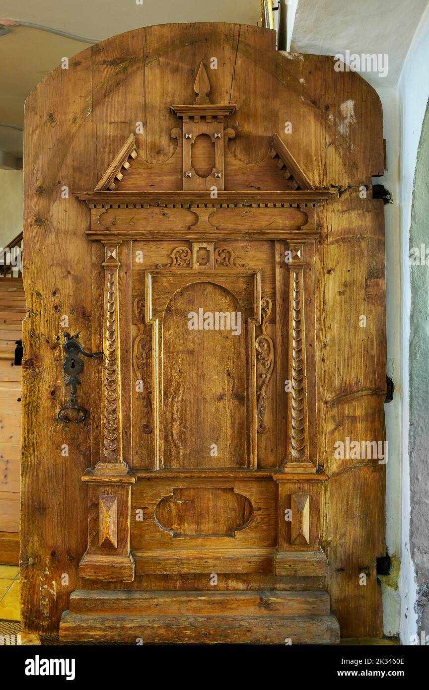 Wooden gate with carvings, Church of St. Anna in Betzigau, Allgaeu, Bavaria, Germany Stock Photo