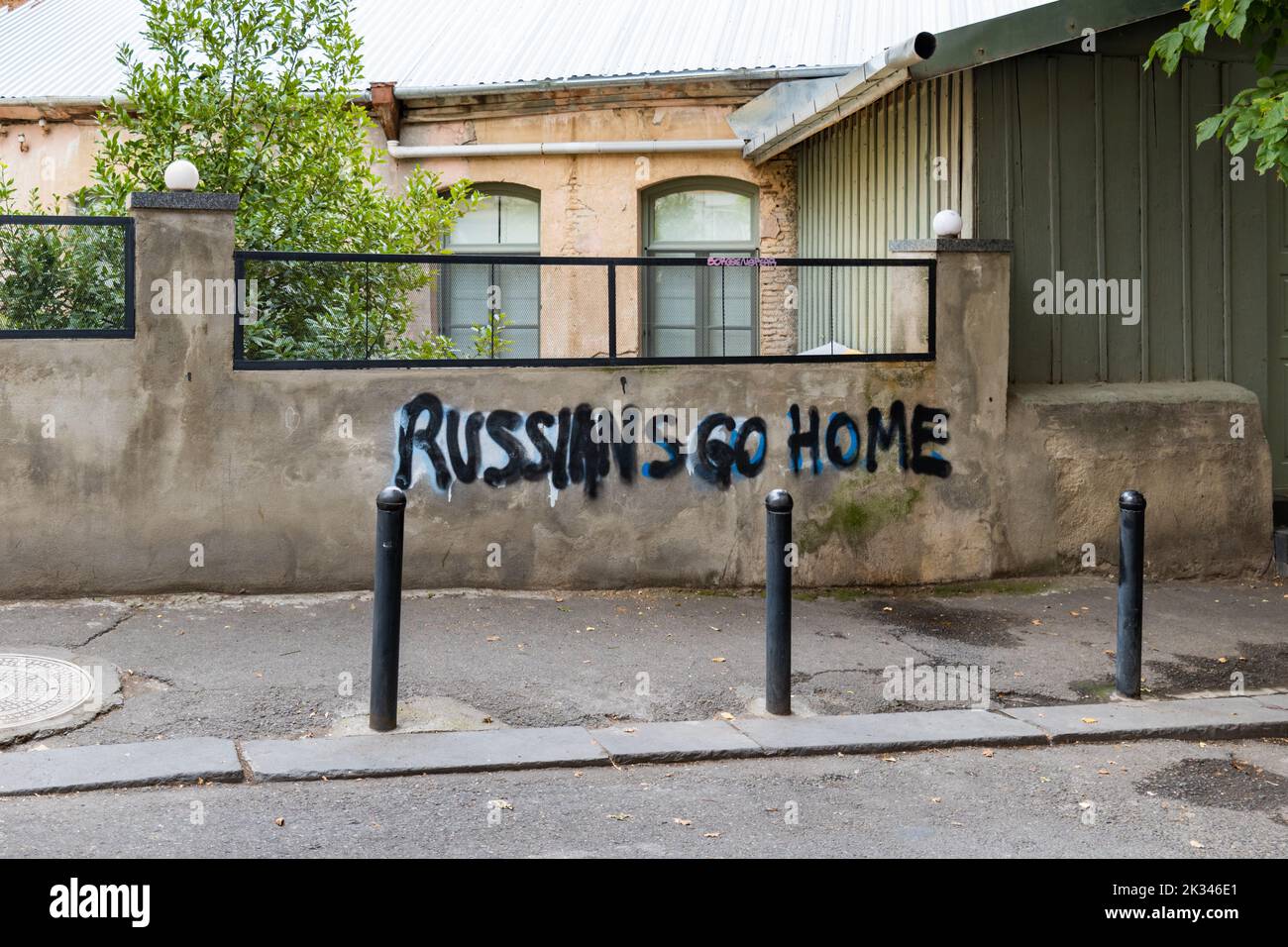 Tbilisi, Georgia - September 2022: Anti Russian slogan or sign on the street in downtown Tbilisi, Georgia. Anti Russian sentiment graffiti in Georgia Stock Photo