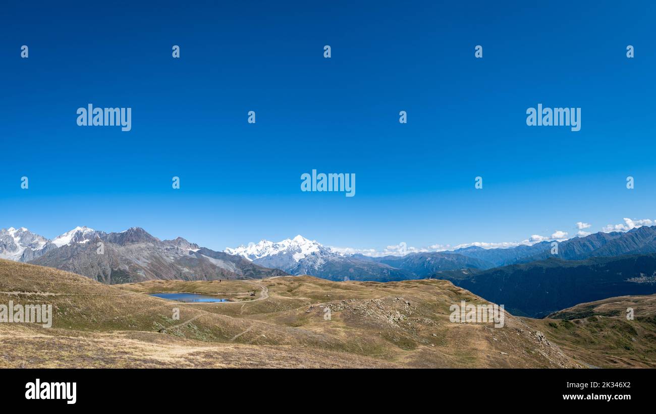 Mountain hiking panorama landscape in Mestia, Svaneti region in Georgia. Landscape of summer mountain around Koruldi lakes area with snow in Caucasus Stock Photo