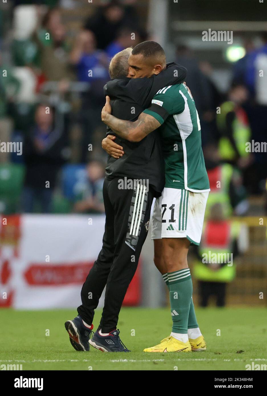 Northern Ireland's Josh Magennis (right) celebrates with a member of the coaching staff after the UEFA Nations League Group J Match at Windsor Park, Belfast. Picture date: Saturday September 24, 2022. Stock Photo