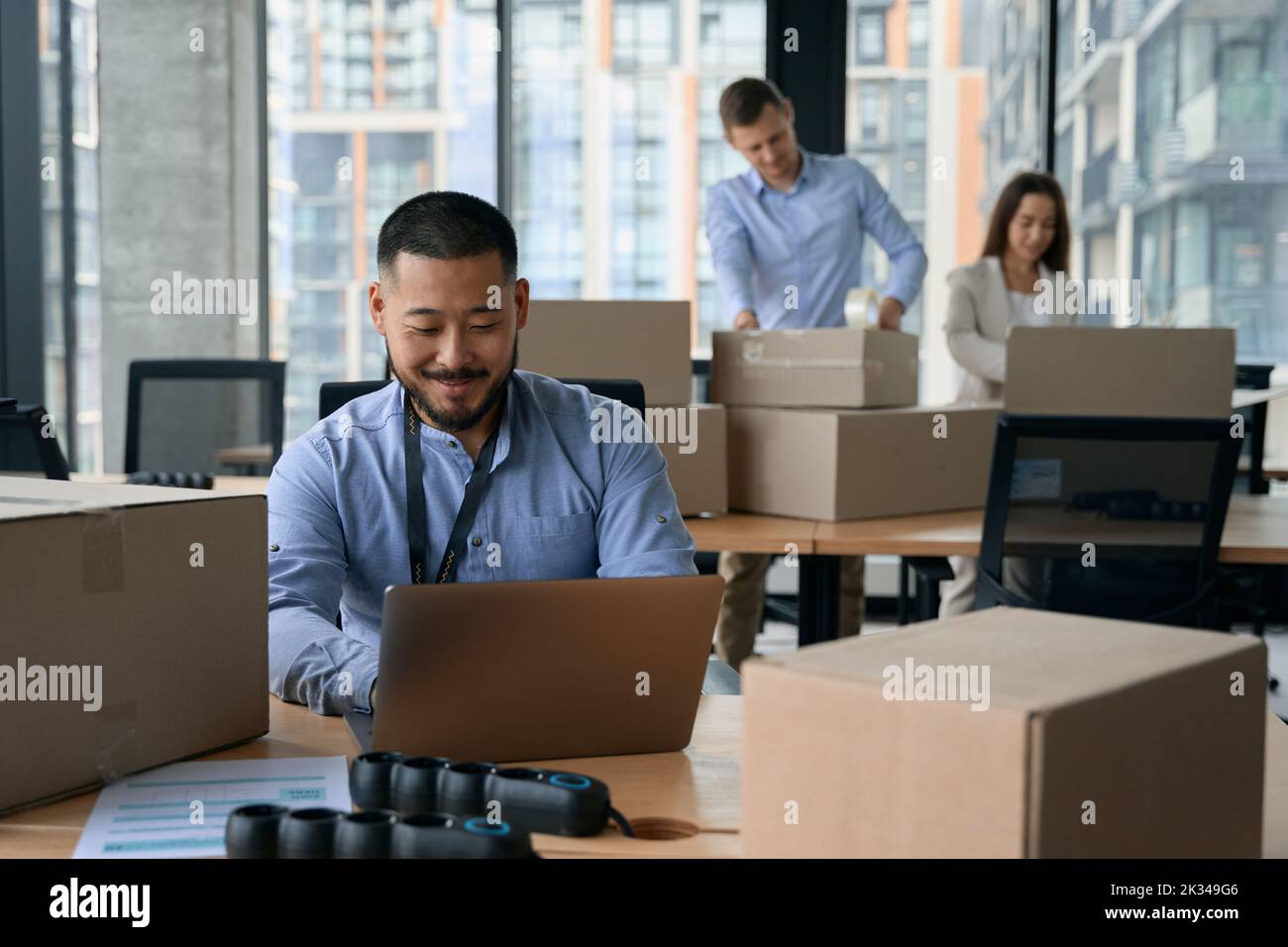 Young corporate employees preparing for office moving Stock Photo
