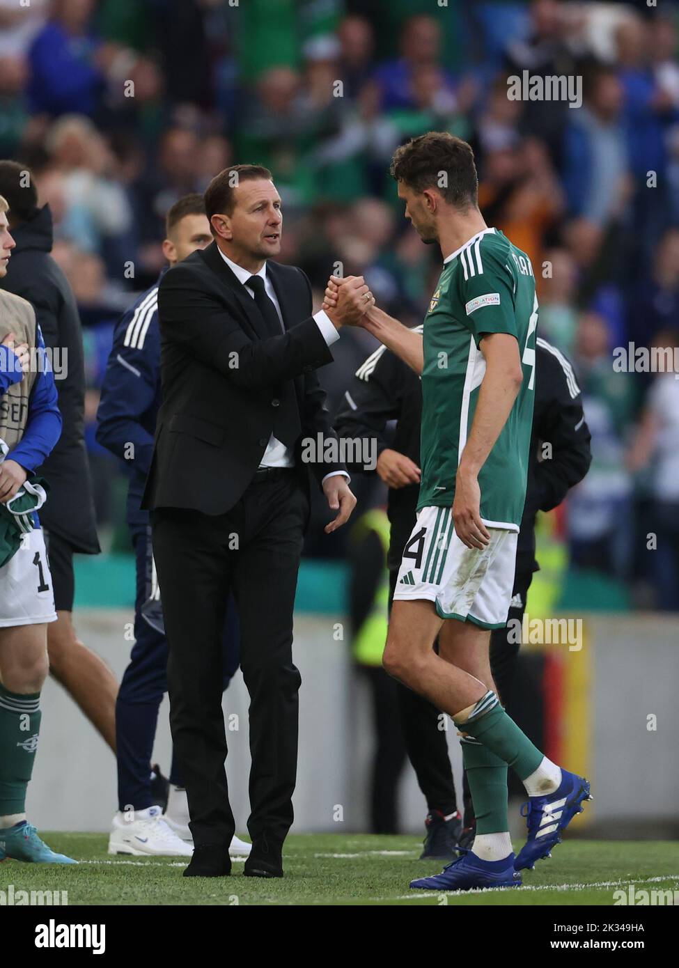 Northern Ireland manager Ian Baraclough (left) congratulates Tom Flanagan as he leaves the pitch during the UEFA Nations League Group J Match at Windsor Park, Belfast. Picture date: Saturday September 24, 2022. Stock Photo
