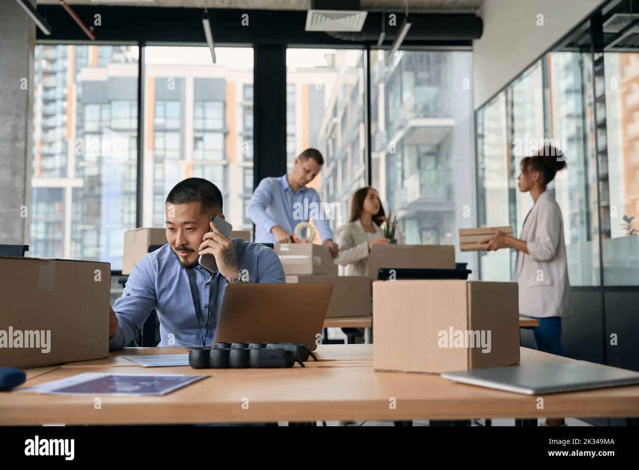 Team of corporate workers preparing for office move Stock Photo