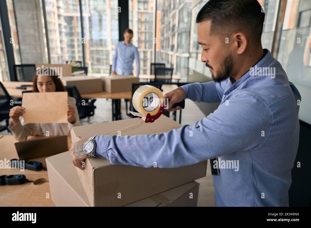 Team of corporate employees preparing for office move Stock Photo