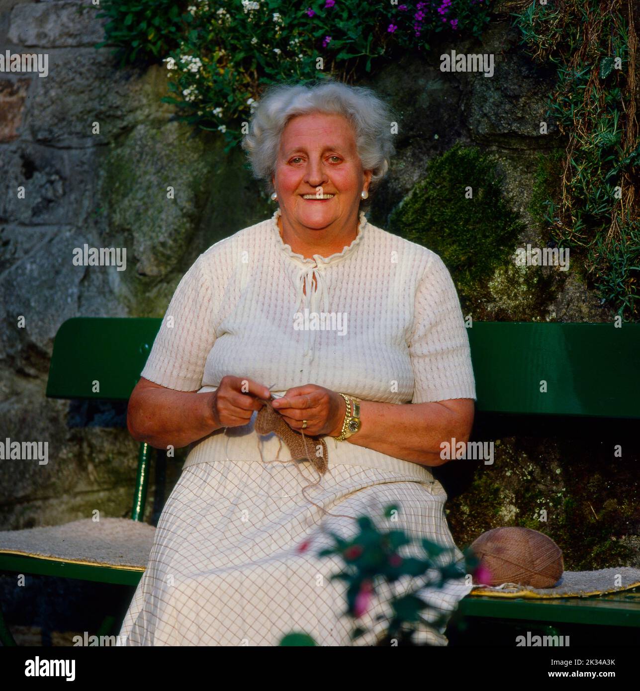 Old woman knitting housework Stock Photo - Alamy