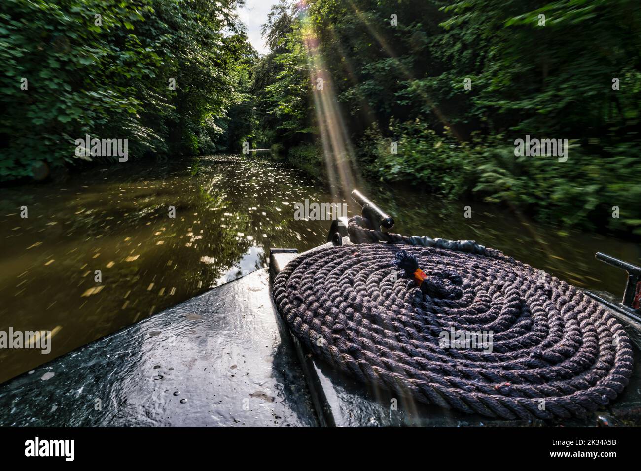 View from prow of a narrow boat barge with coiled rope on the Union Canal with a rope, Scotland, UK Stock Photo