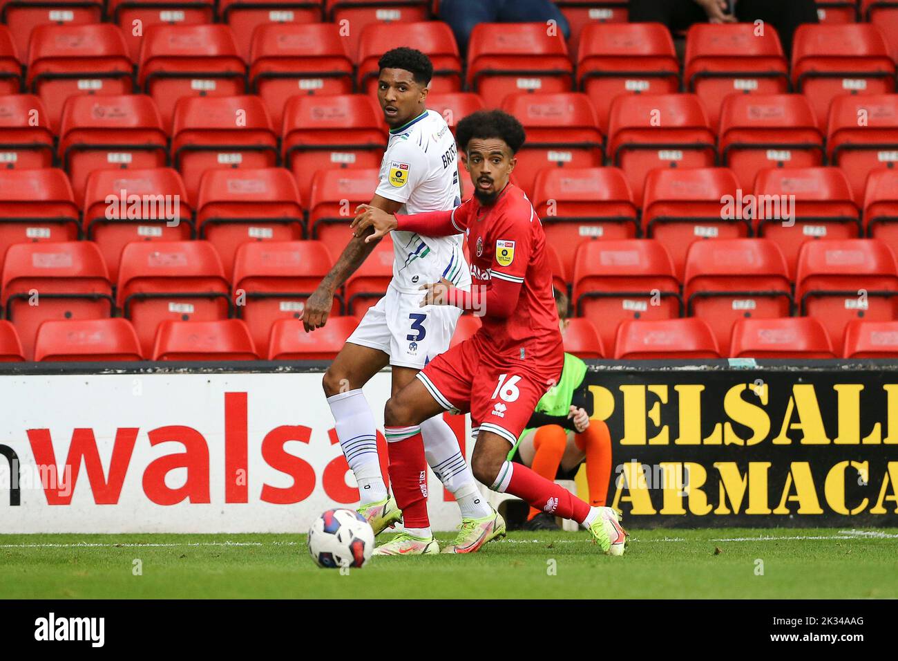 Walsall, UK. 24th Sep, 2022. Jacob Maddox of Walsall (16) and Ethan Bristow of Tranmere Rovers in action. EFL Skybet Football league two match, Walsall v Tranmere Rovers at the Poundland Bescot Stadium in Walsall, West Midlands on Saturday 24th September 2022. this image may only be used for Editorial purposes. Editorial use only, license required for commercial use. No use in betting, games or a single club/league/player publications.pic by Chris Stading/Andrew Orchard sports photography/Alamy Live News Credit: Andrew Orchard sports photography/Alamy Live News Stock Photo