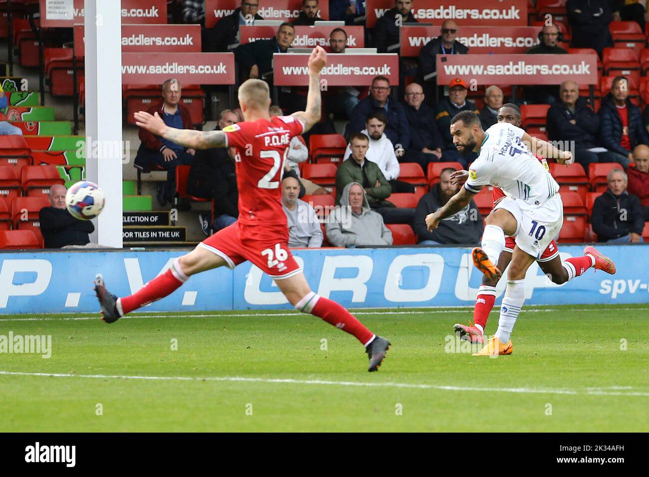 Walsall, UK. 24th Sep, 2022. Kane Hemmings of Tranmere Rovers (r) shoots but sees his effort saved. EFL Skybet Football league two match, Walsall v Tranmere Rovers at the Poundland Bescot Stadium in Walsall, West Midlands on Saturday 24th September 2022. this image may only be used for Editorial purposes. Editorial use only, license required for commercial use. No use in betting, games or a single club/league/player publications.pic by Chris Stading/Andrew Orchard sports photography/Alamy Live News Credit: Andrew Orchard sports photography/Alamy Live News Stock Photo