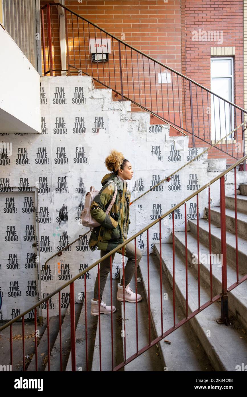 Person ascending stairs hi-res stock photography and images - Alamy