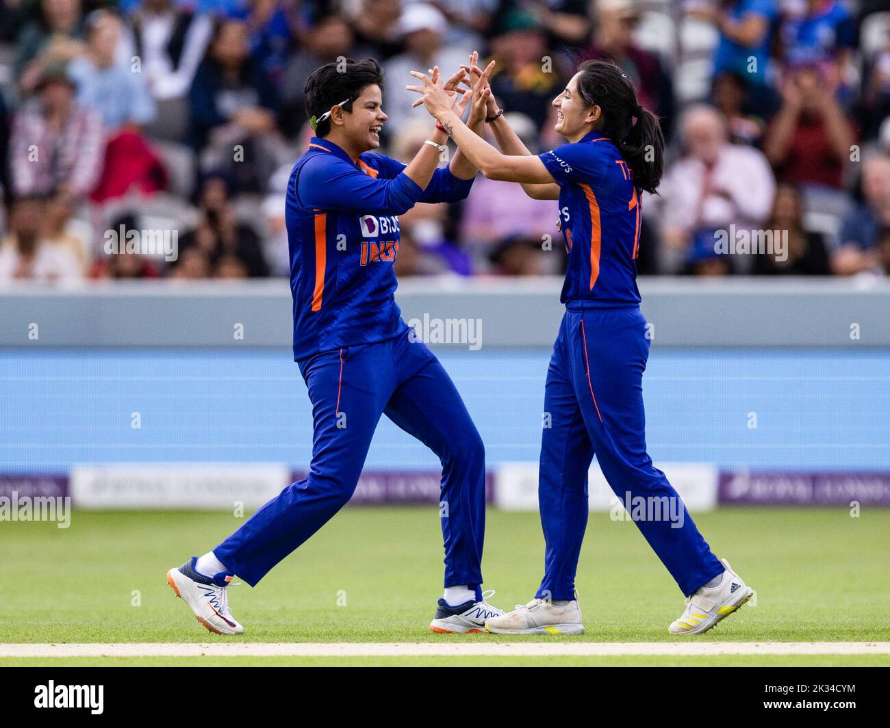 India’s Renuka Thakur (right) celebrates with Shafali Verma the wicket of England's Emma Lamb (not in picture) during the third women's one day international match at Lord's, London. Picture date: Saturday September 24, 2022. Stock Photo