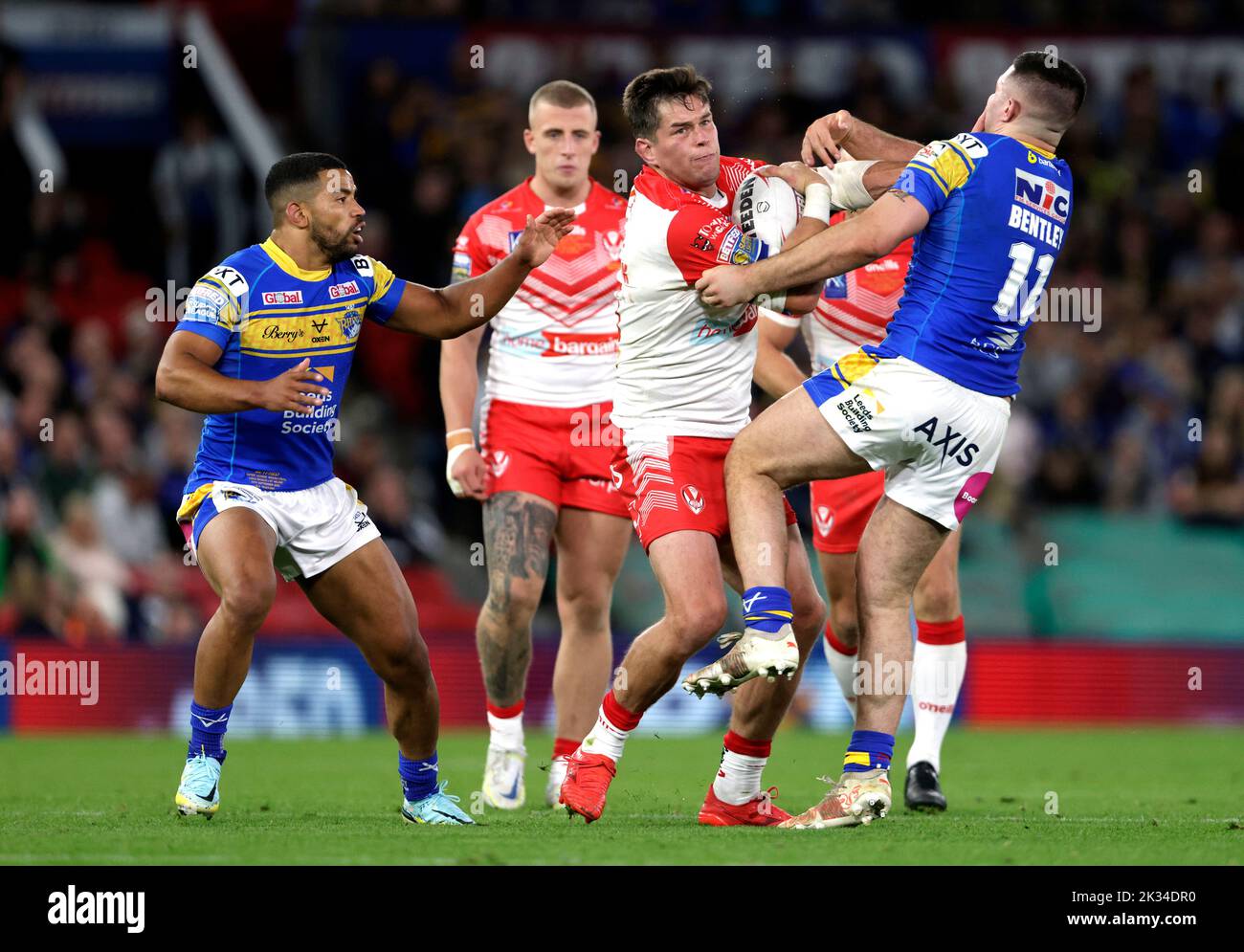 St Helens' Louie McCarthy-Scarsbrook is tackled by Leeds Rhinos' James Bentley (right) during the Betfred Super League Grand Final at Old Trafford, Manchester. Picture date: Saturday September 24, 2022. Stock Photo