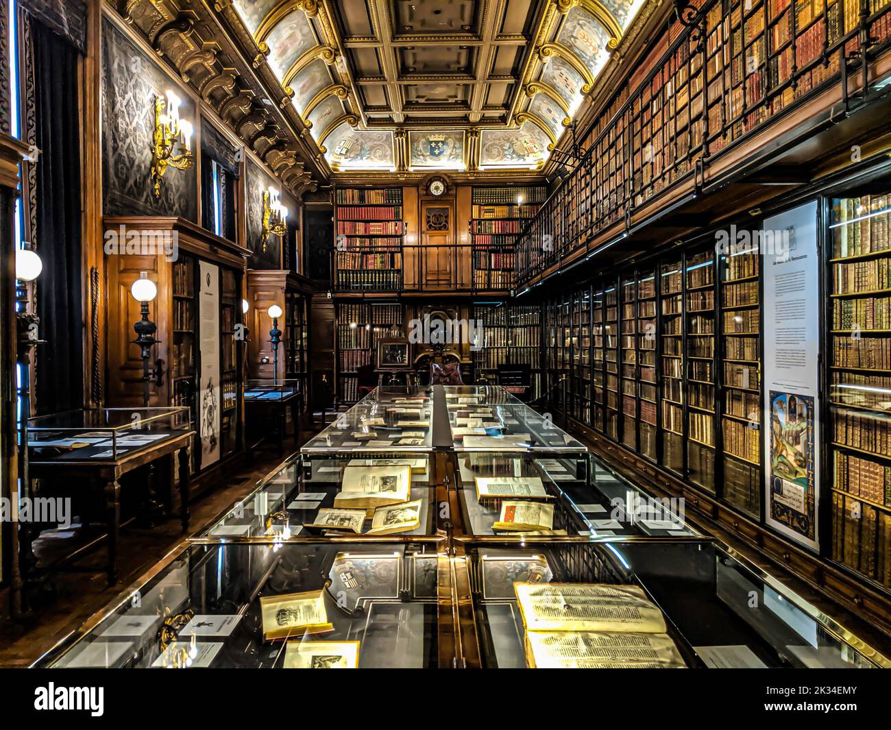 Old wood library with ancient books and documents, beautiful light in
