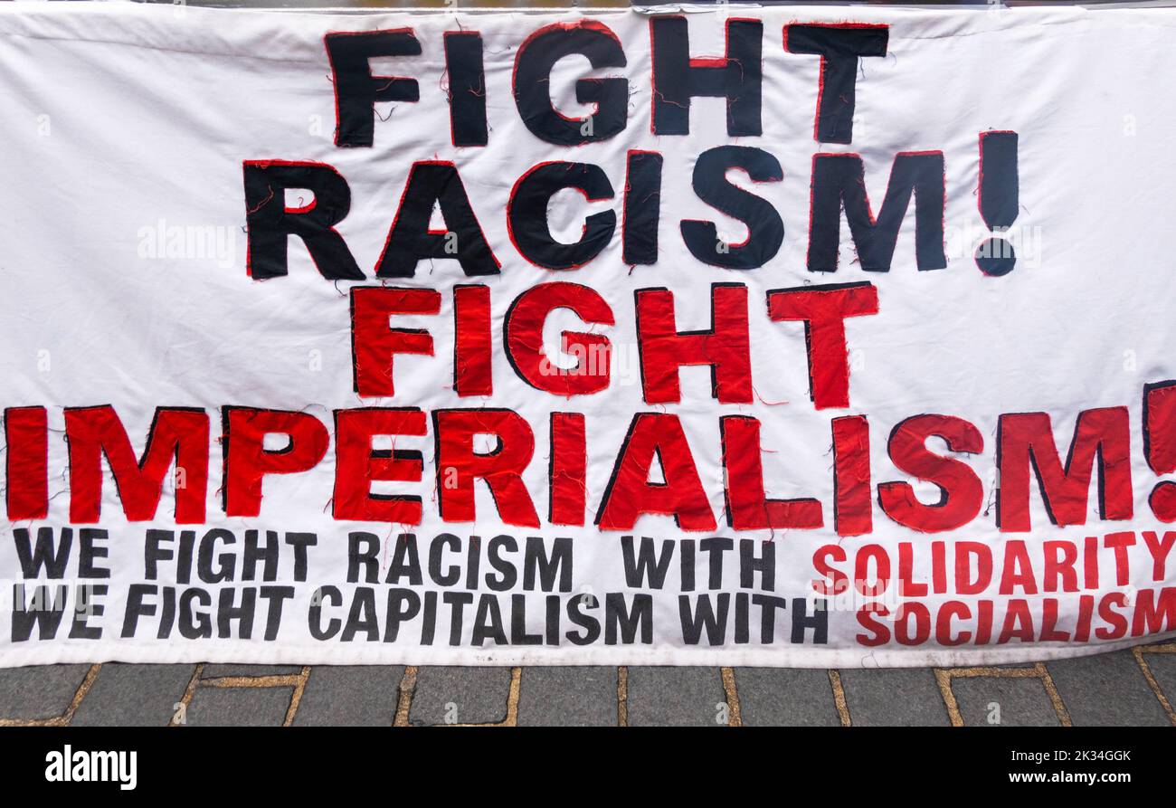 Political banner in Liverpool. Fight Racism! Fight Imperialism! Stock Photo