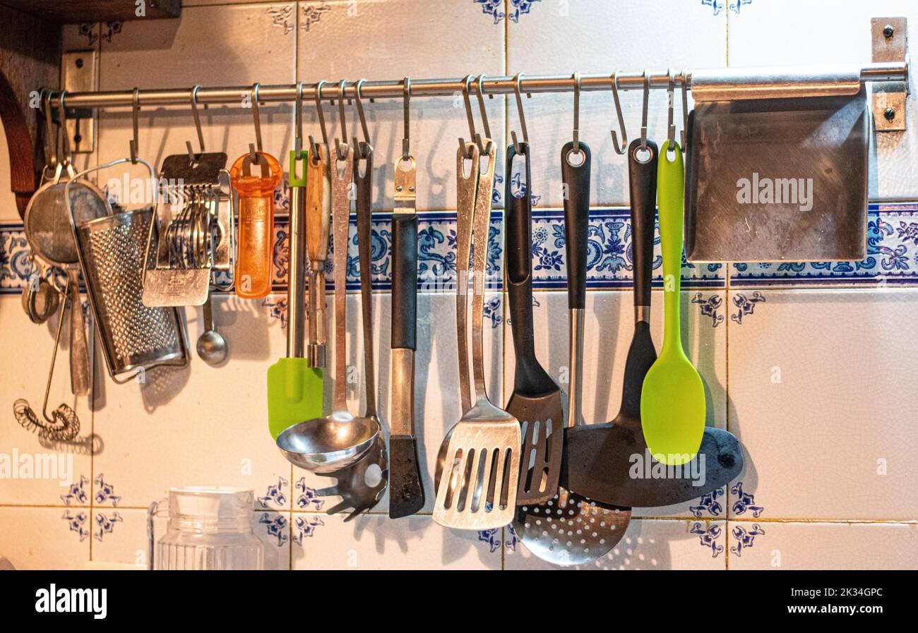 Kitchen utensils hanging on the wall Stock Photo Alamy